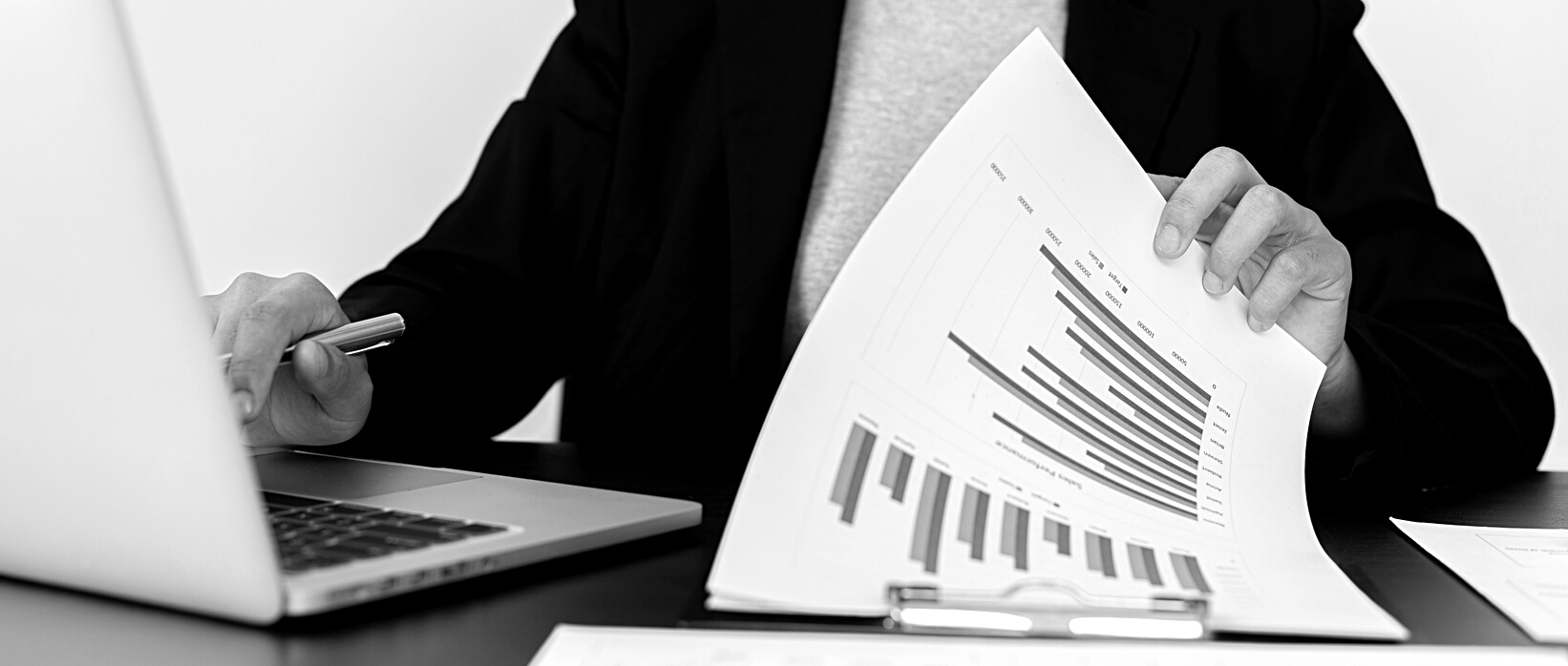 Businessman with Laptop and Documents